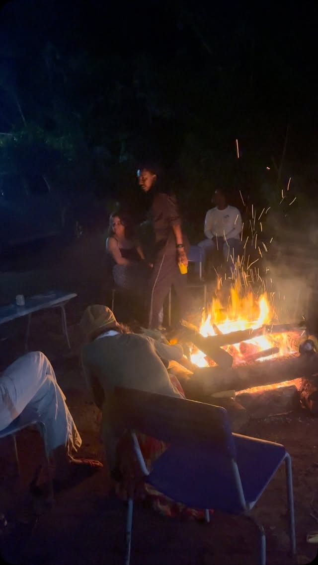 Community gathering around the fire at Kilombo Tenondé